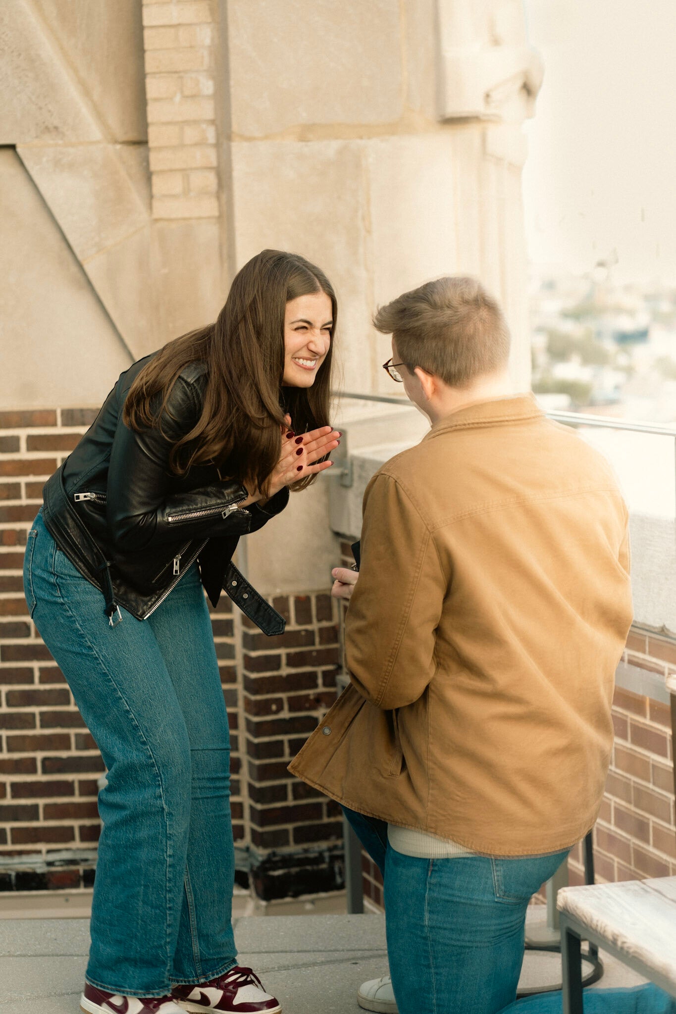 couple's surprise proposal on top of a rooftop in chicago