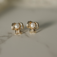 gold and pearl bow stud earrings lifestyle