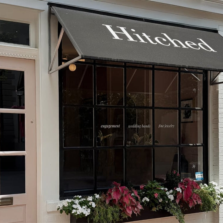 Hitched DC jewelry store storefront with awning and window display in Georgetown