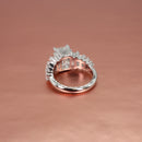 platinum ring with diamond accents on a rose gold background
