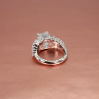 platinum ring with diamond accents on a rose gold background