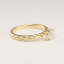 side view angle of leaf texture on an engagement ring setting