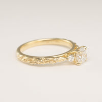 side view angle of leaf texture on an engagement ring setting