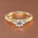 front view angle of a three stone engagement ring setting with leaf detailing
