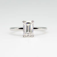 hitched white gold signature solitaire engagement ring with emerald center and double talon prongs