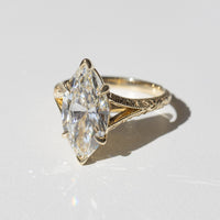 front view of a split-shank filigree and milgrain engagement ring