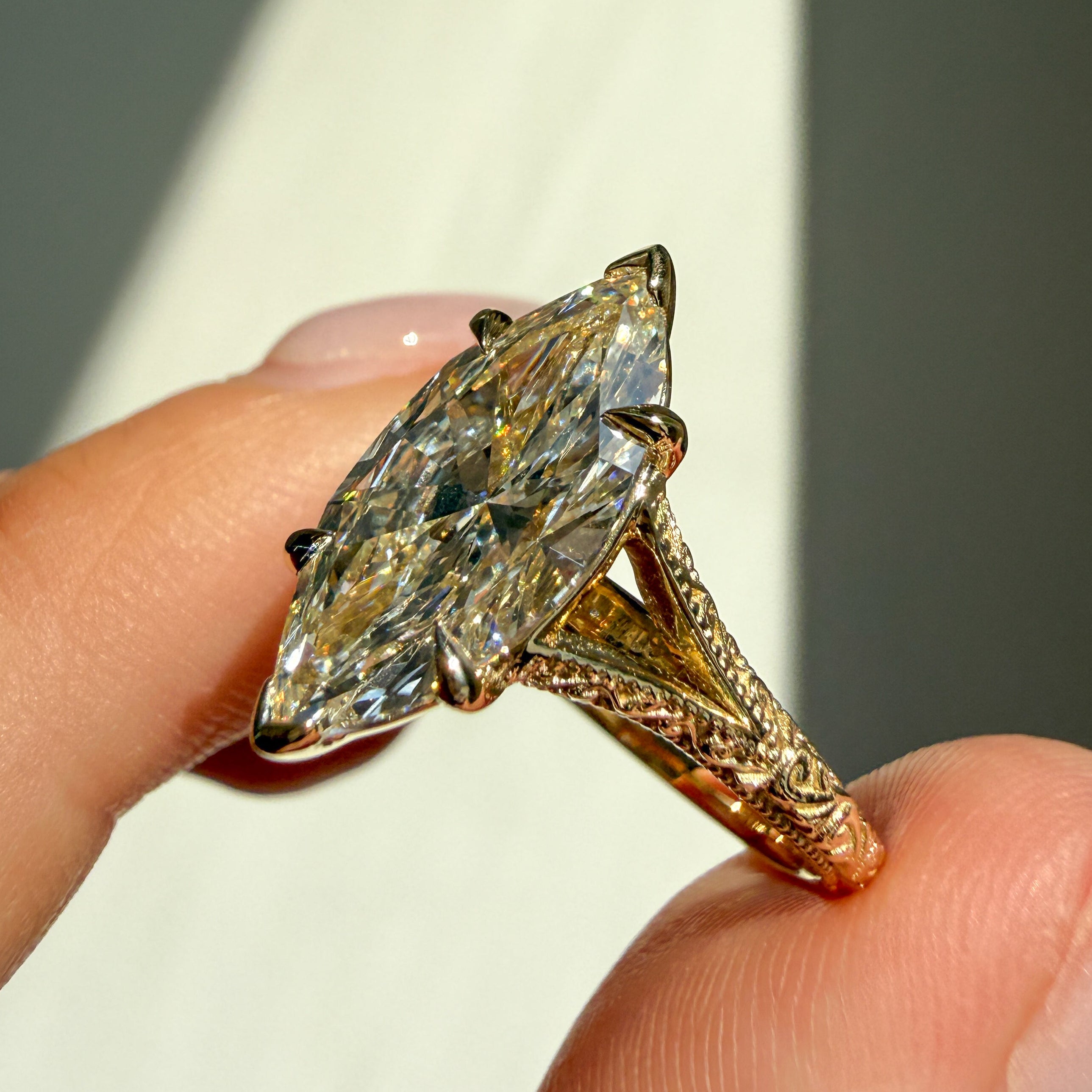 side view of a split-shank filigree and milgrain engagement ring