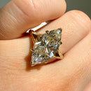 on hand view of a split-shank filigree and milgrain engagement ring