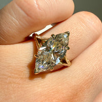 on hand view of a split-shank filigree and milgrain engagement ring