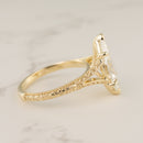 side view of a split-shank filigree and milgrain engagement ring