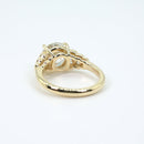 Gold vintage-inspired ring with intricate design on a white background
