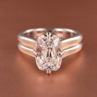 An engagement ring with a bold double band setting and compass set prongs