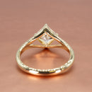 Basket view of a yellow gold split shank engagement ring with a kite set asscher cut diamond