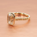 hitched yellow gold bezel set engagement ring with rose filigree detail and old mine diamond center