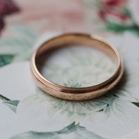 hitched rose gold milgrain men's wedding band in 4mm width