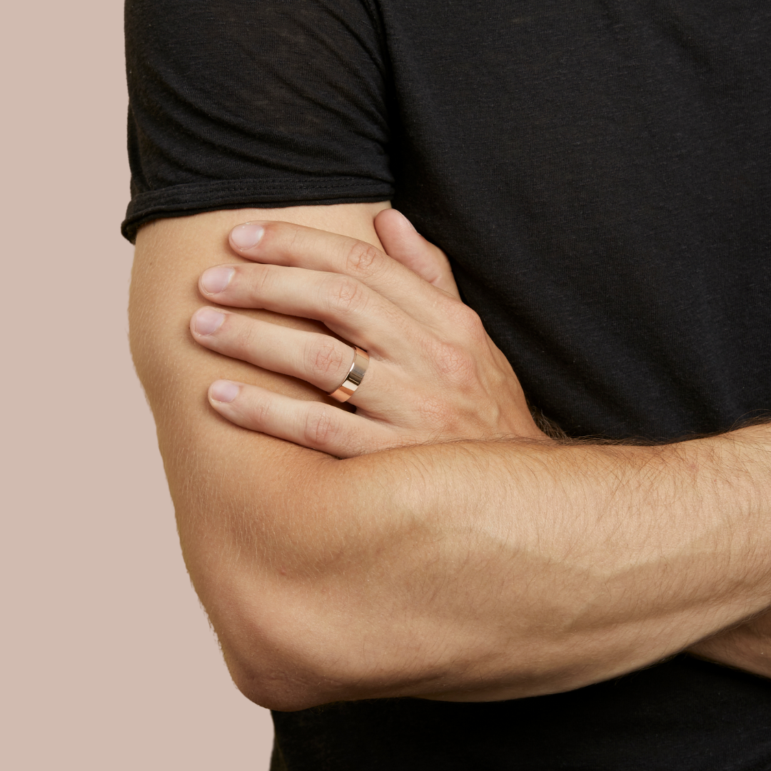 hitched men's rose gold flat wedding band in a 6mm width on model