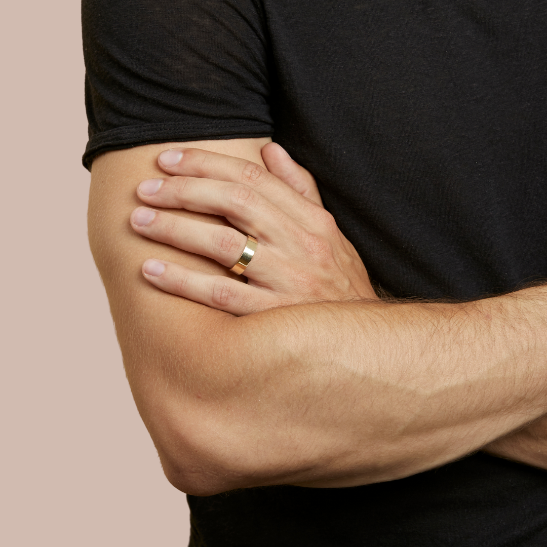 hitched men's yellow gold flat wedding band in a 6mm width on model